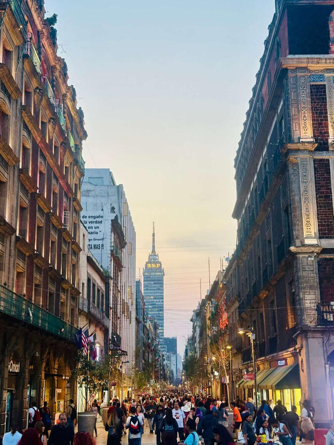 pedestrian street in Mexico City's historic center with a view of the Torre Latinoamericana, captured during a walking tour.