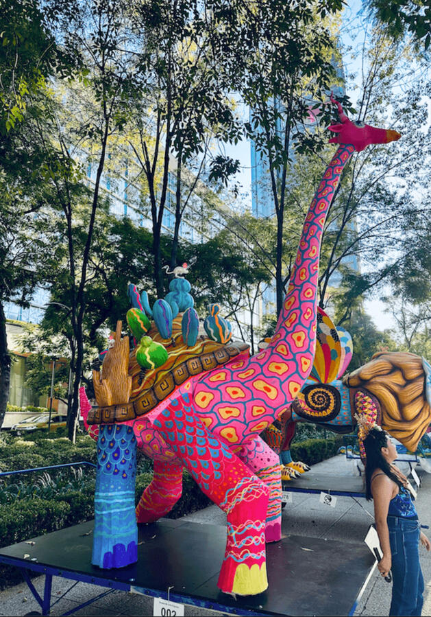 Large, colorful alebrije sculpture on display in Mexico City, traditional folk art during our cultural walking experiences.