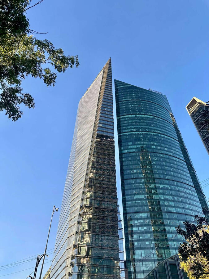 Modern Icons of Mexico City Striking modern glass skyscrapers highlighting the contemporary architectural contrast in Mexico City's financial district