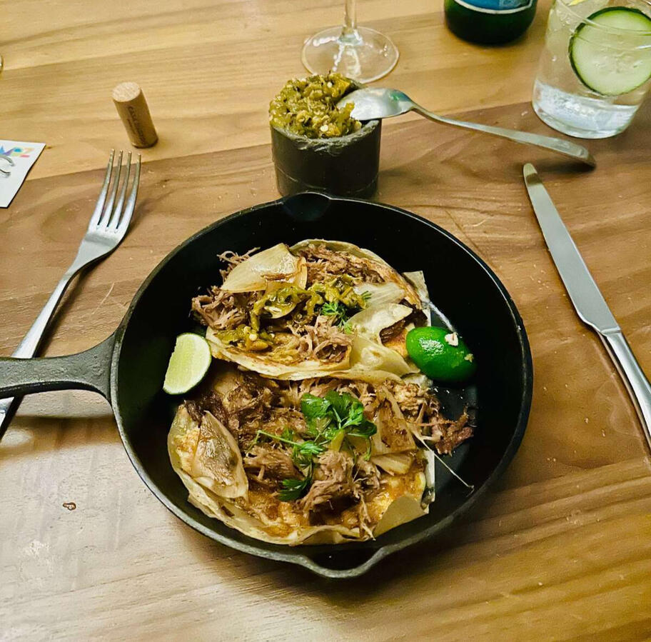 Delicious gourmet tacos served in a cast-iron skillet, during a private experience in Mexico City.