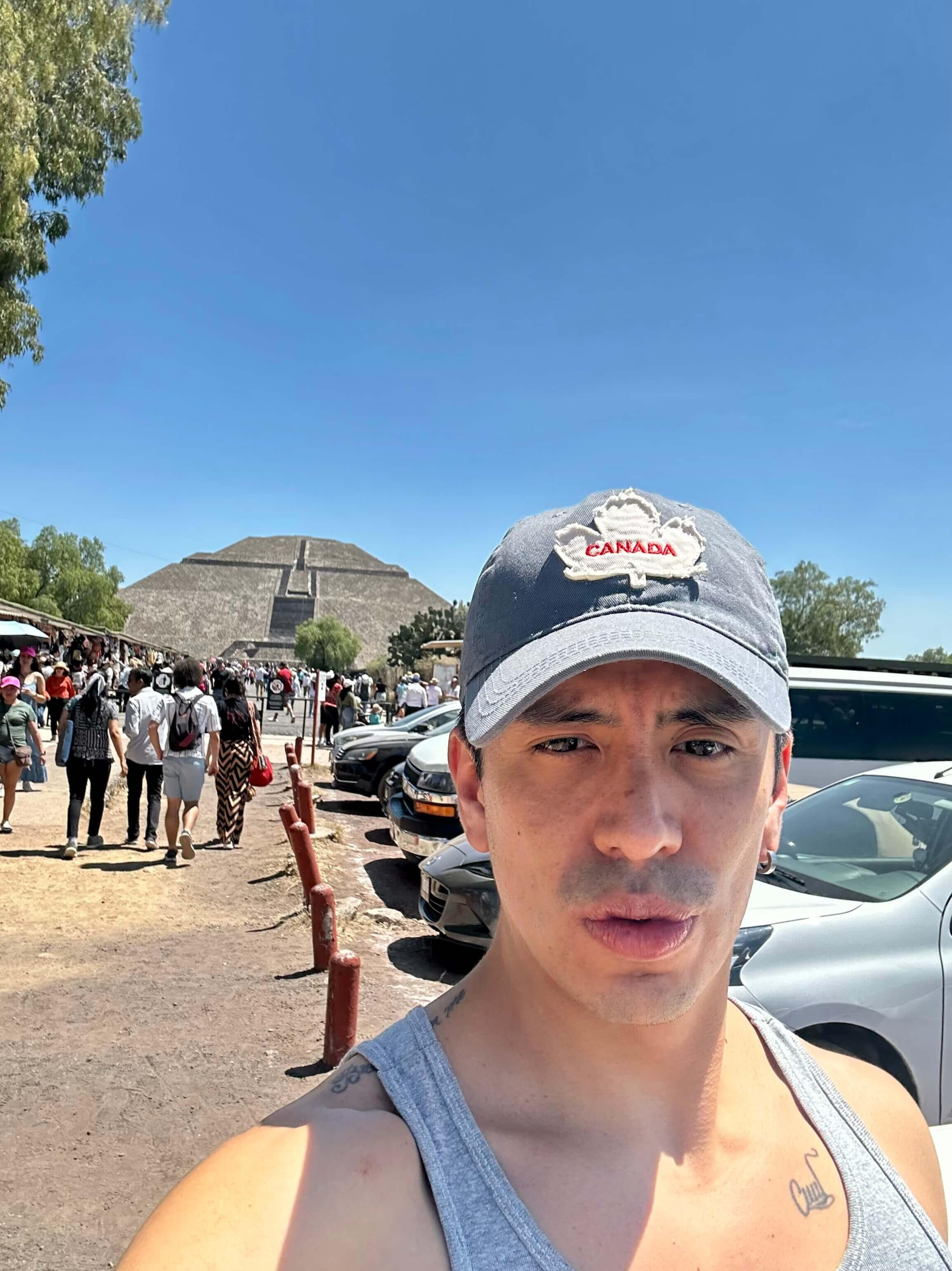 A warm selfie of Erik, your private guide, posing with the massive Pyramid of the Sun in Teotihuacan, highlighting the personalized connection of our exclusive cultural tours near Mexico City.
